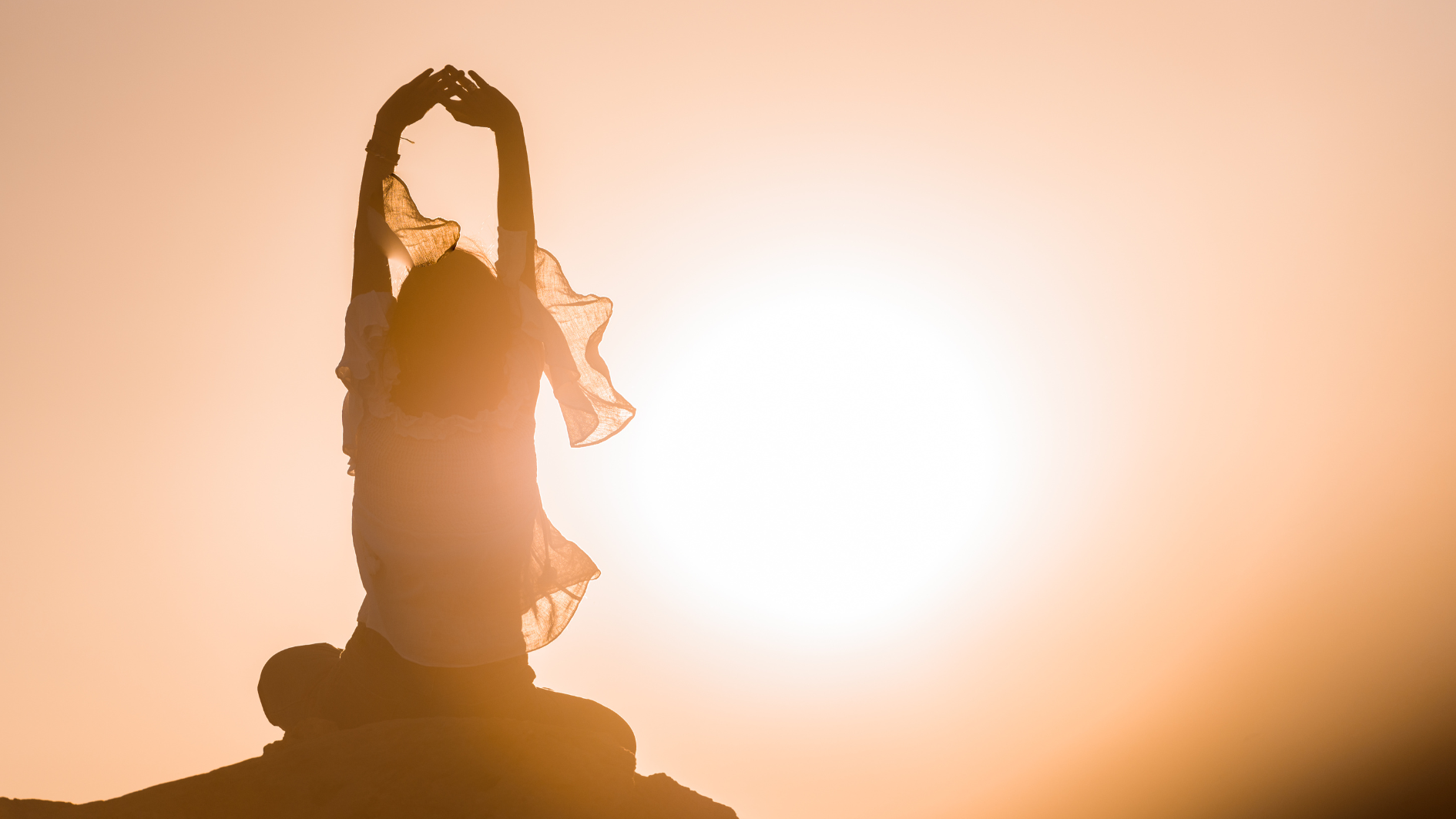 “Woman sitting, natural light on her face, symbolizing circadian rhythm and metabolic health during menopause.”
